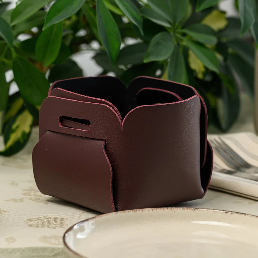 Elegant leather valet tray or bread holder in a sophisticated dark wine-red hue, featuring a unique no-stitch assembly and structured sides. Perfect for a modern or rustic tabletop decor