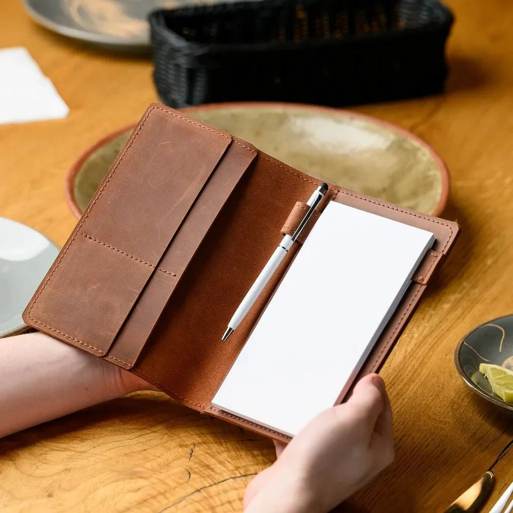 Vintage Crazy Horse leather waiter’s notebook with a practical closure, offering both style and functionality for professionals.