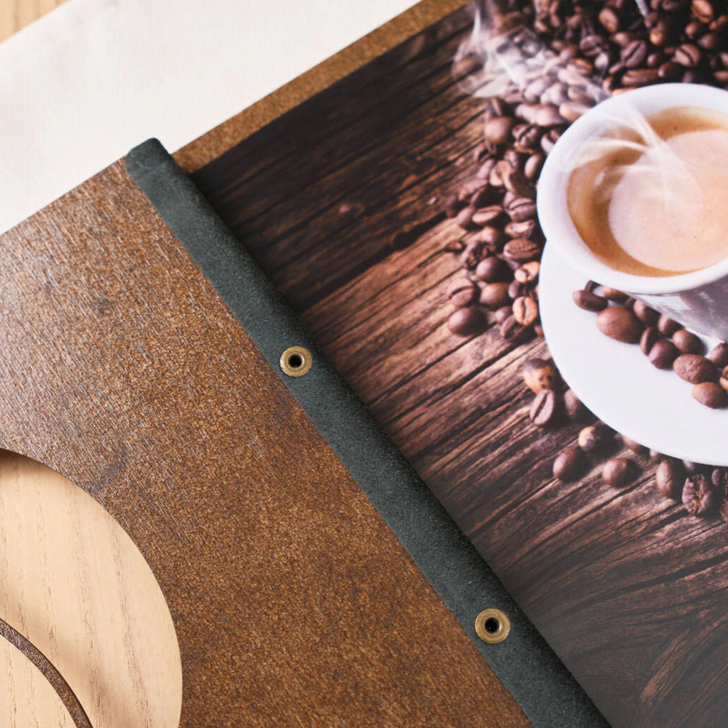 Walnut wood menu cover featuring an engraved scale pattern and a coffee bean shaped cutout.