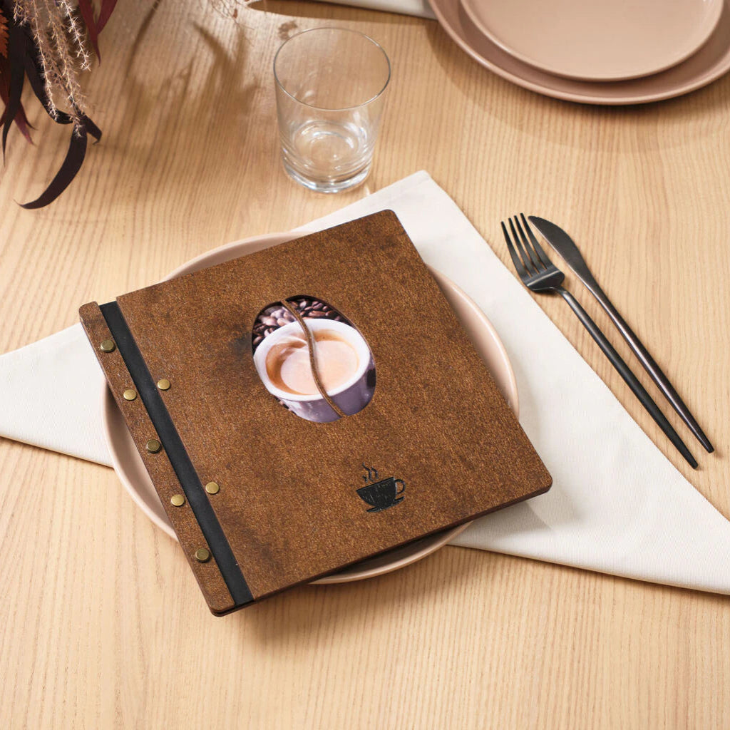 Close-up of a wooden menu cover with white topographic map engravings and black leather binding.