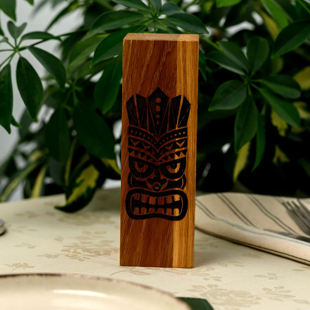 Vertical oak wood "Reserved" sign with Tiki mask engraving for restaurant table management