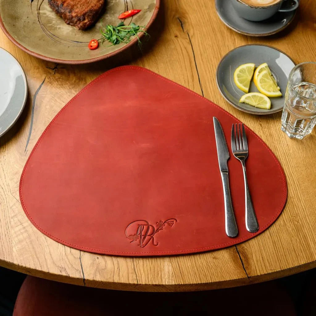 Premium teardrop-shaped Crazy Horse leather placemat, handcrafted with a vintage finish. Perfect for rustic, modern, or industrial-style dining table settings.