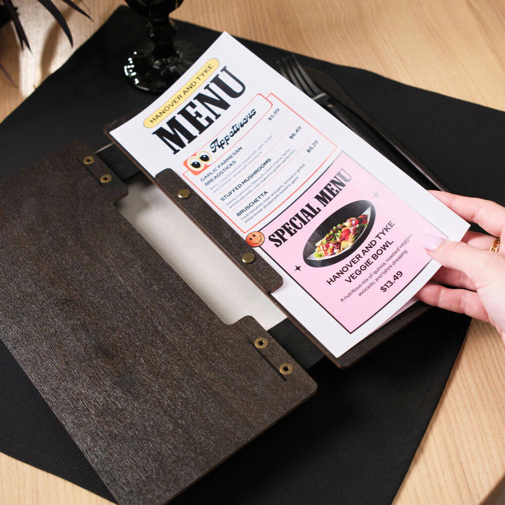 The menu inserts can feature full-color graphics, such as food photography and stylized text for "Appetizers" and "Special Menu" sections.