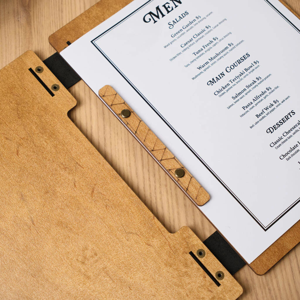 Detailed photo of the menu fixation mechanism on an engraved wooden base, highlighting the natural wood texture
