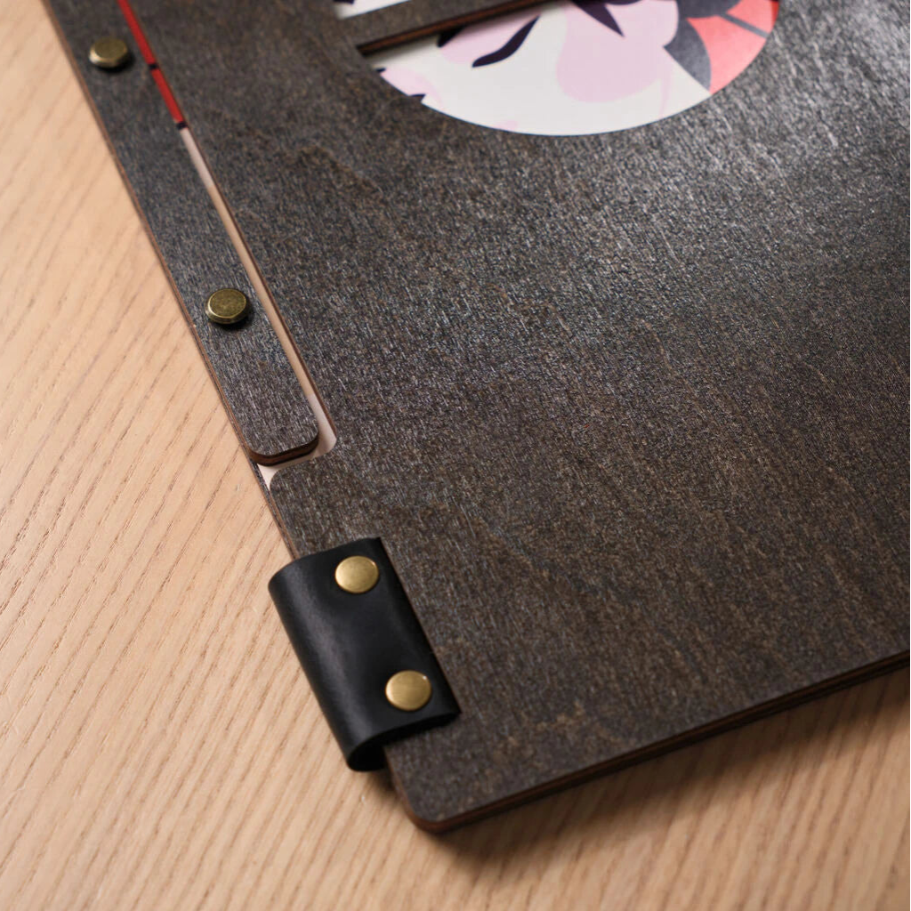 Angled view showing the circular cutout revealing artwork.