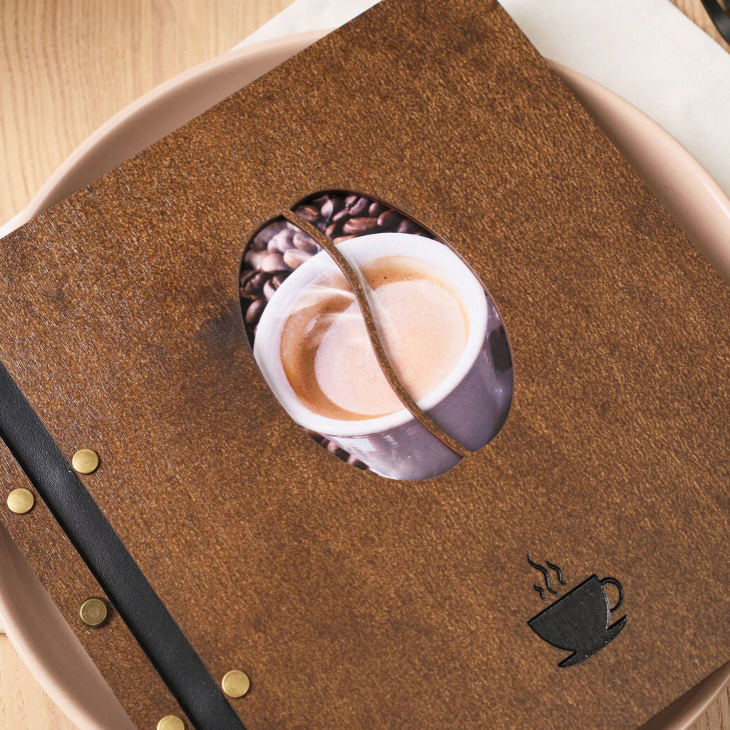 Detailed view of the internal screw-post binding and black leather straps inside a wooden menu.