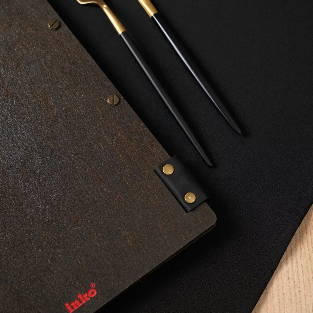 Side view focusing on the black leather hinge and metal fasteners.