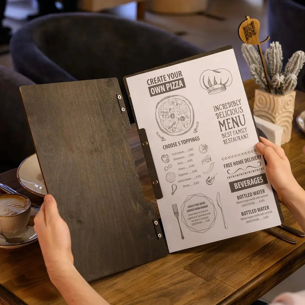 Custom-made menu covers restaurant with embossed logos.