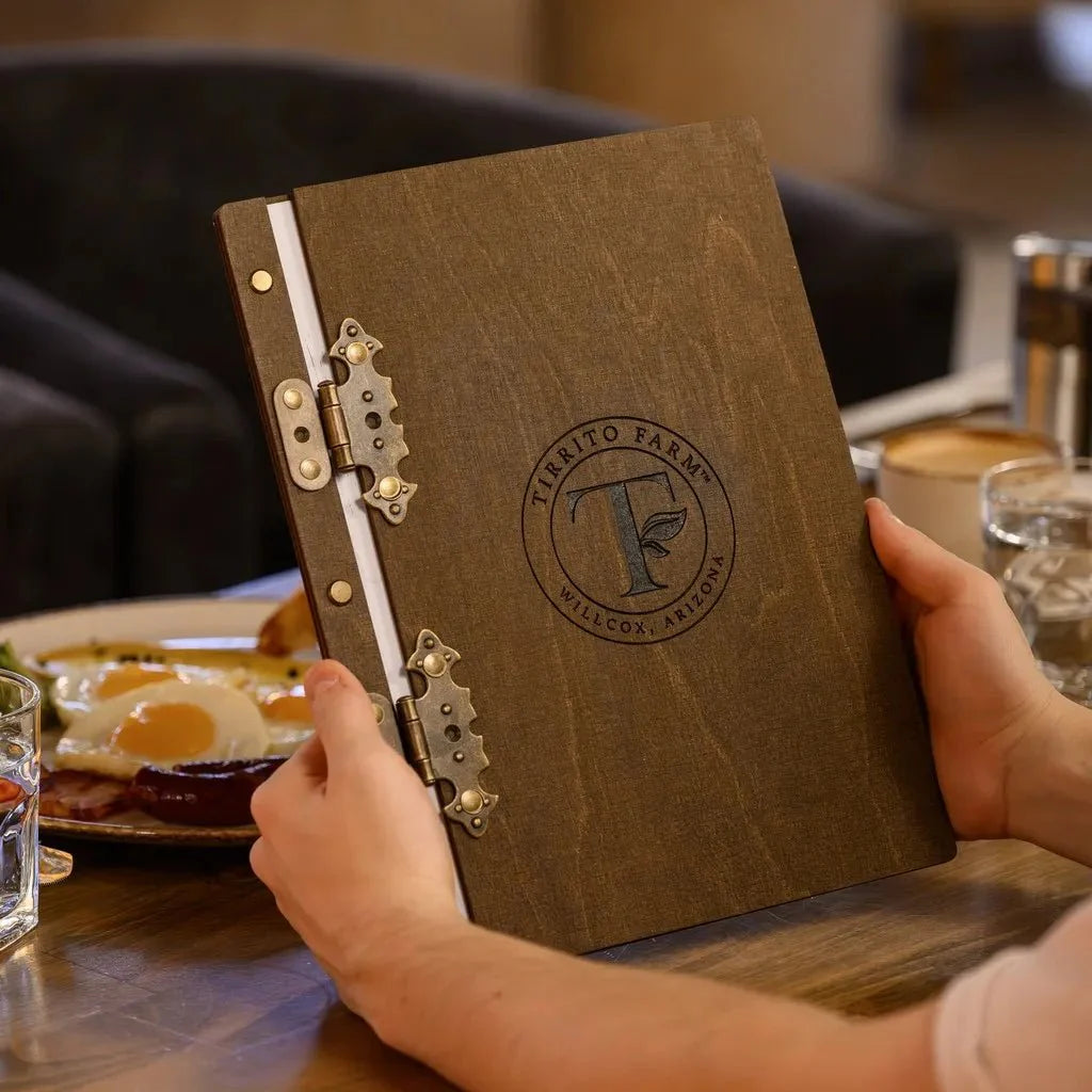 Eco-conscious menu covers made from sustainable wood.