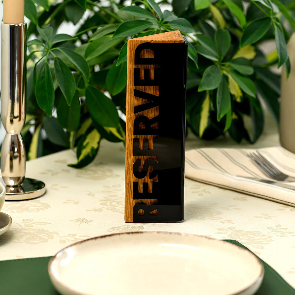 Tabletop 'Reserved' sign made of natural wood and black acrylic for cafes and restaurants