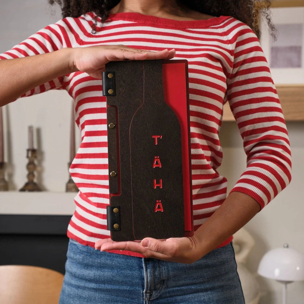 Custom wooden menu holder with a wine bottle shaped cutout and red color engraving. This unique menu board features a dark wood finish and professional bolt binding